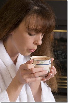 Woman sips hot chocolate